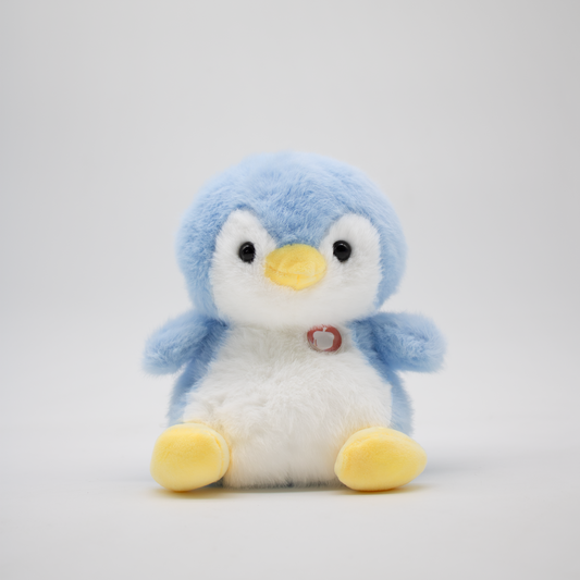 Plush penguin with blue body and yellow feet on a light gray background