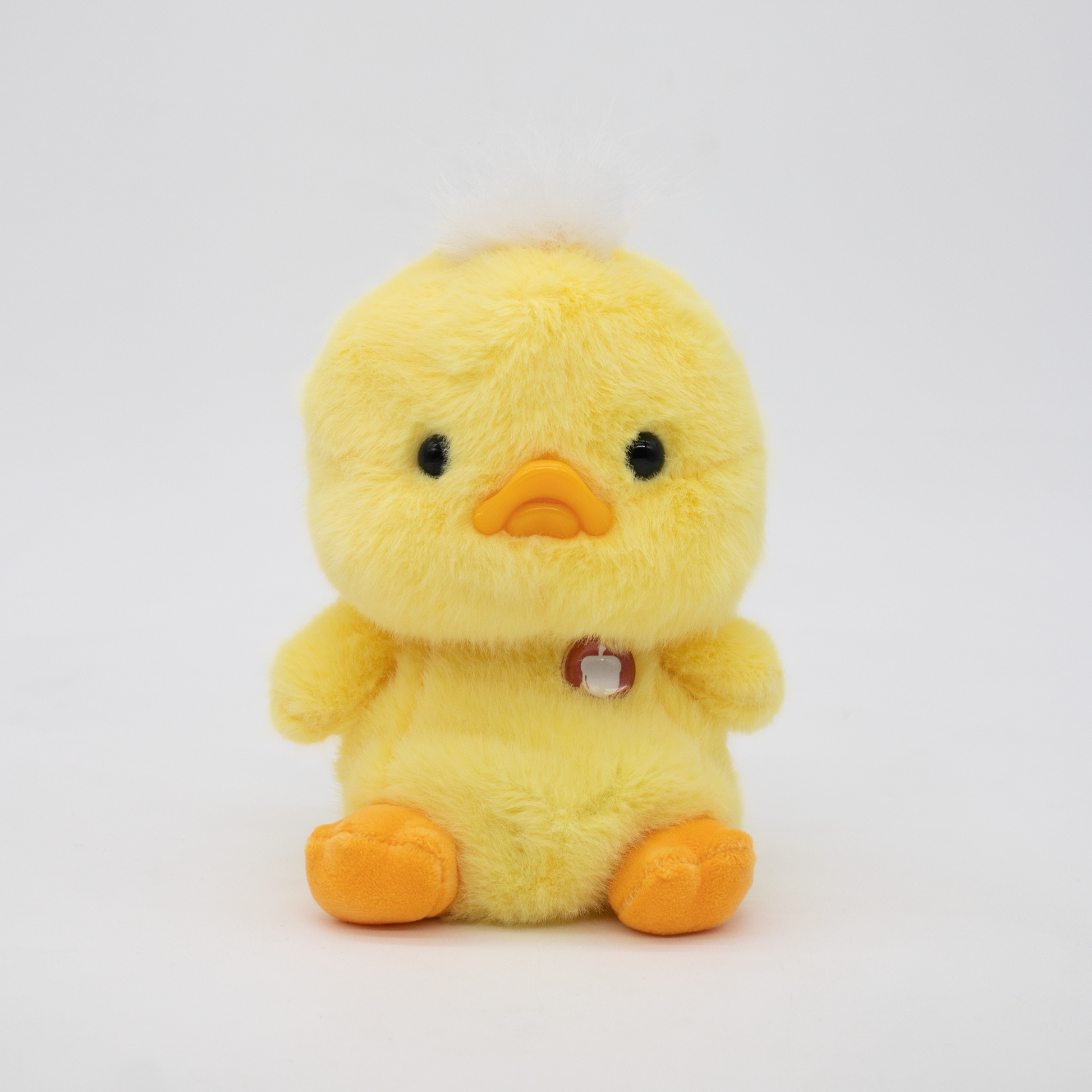 Yellow plush duck on a white background