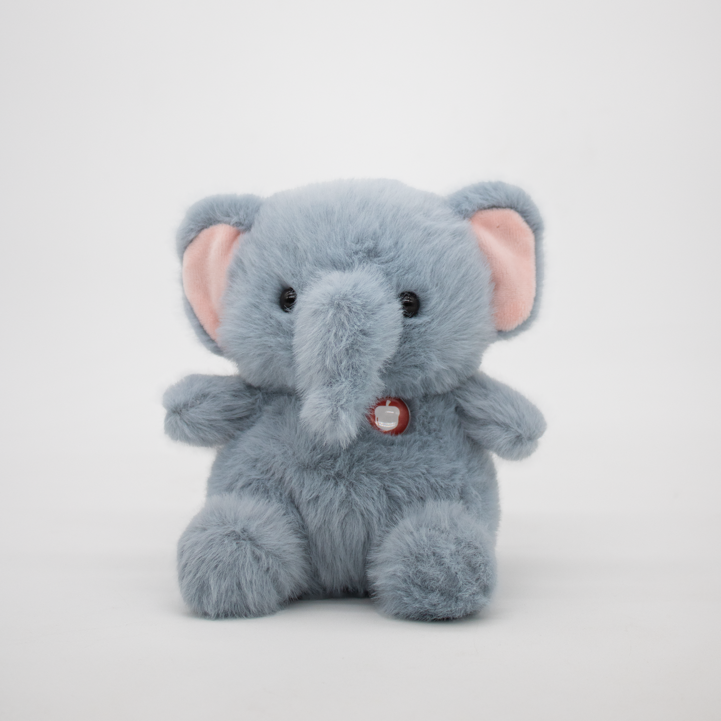 Plush elephant on a white background