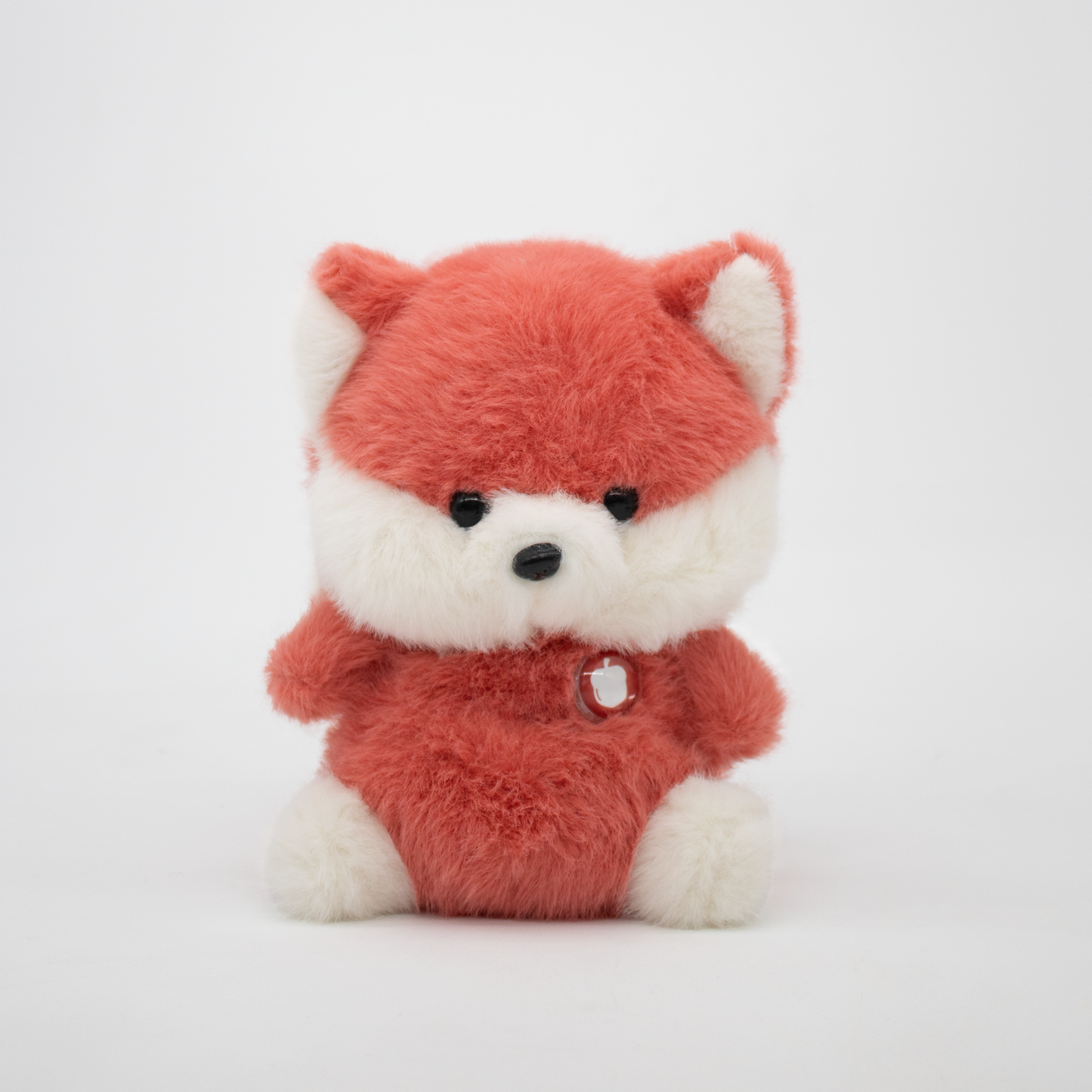 Red fox plush with a white background