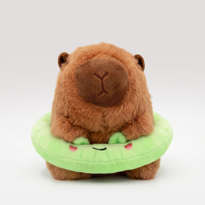 Soft Capybara plush wearing a bright green frog floatie